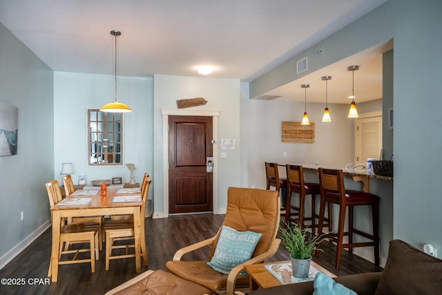 dining area with dark wood-type flooring