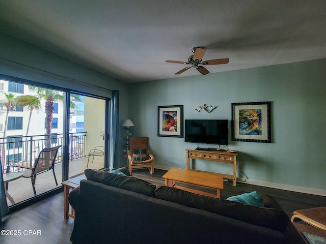 living room featuring hardwood / wood-style floors and ceiling fan