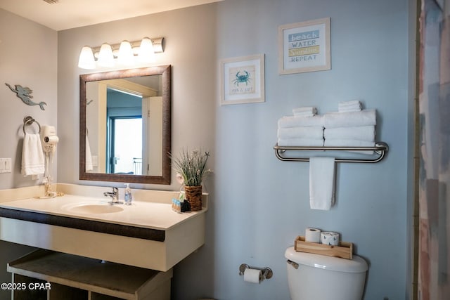 bathroom with vanity and toilet