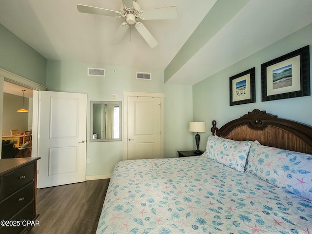 bedroom featuring ceiling fan, a closet, and dark hardwood / wood-style floors