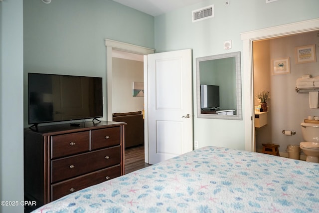 bedroom featuring ensuite bath