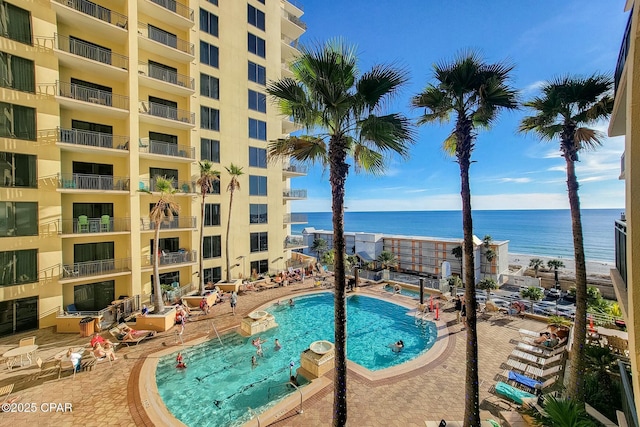 view of pool featuring a water view