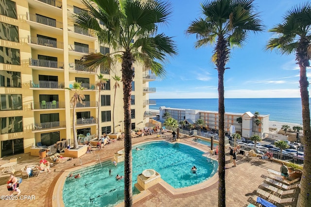 view of pool featuring a water view