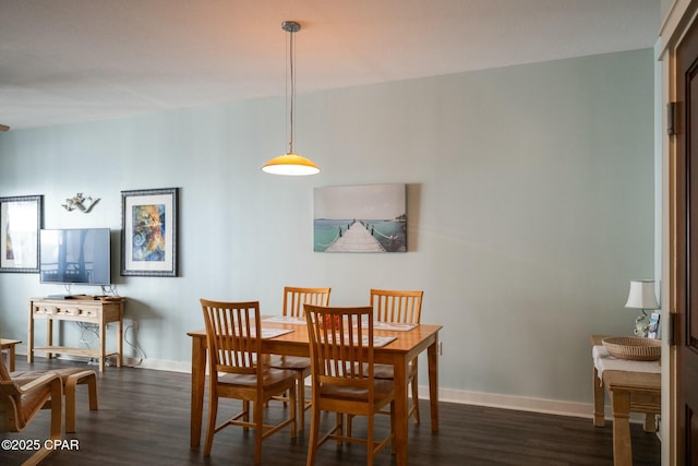 dining room with dark hardwood / wood-style floors