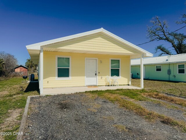 view of exterior entry featuring a porch