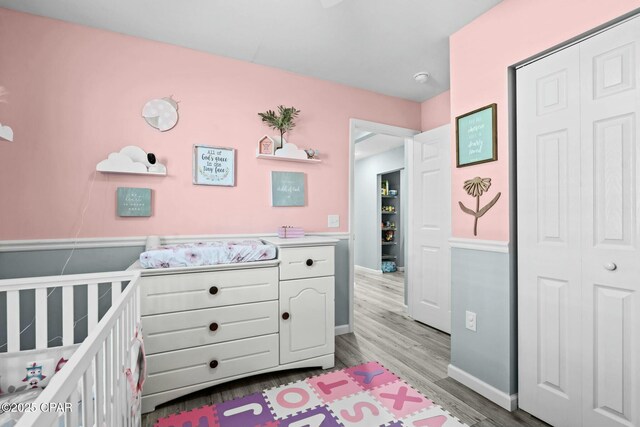 3111 E 2nd Plz, Panama City, FL 32401 - bedroom featuring dark wood-style floors, a closet, and baseboards
