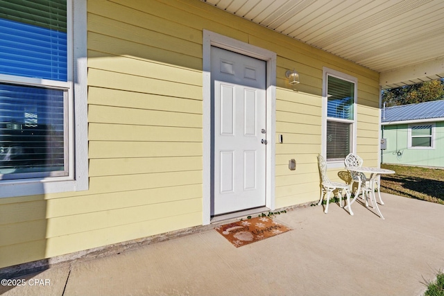 doorway to property featuring a porch