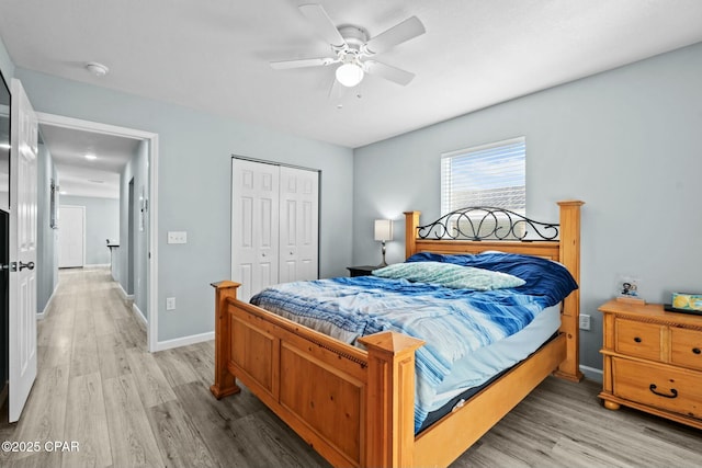 3111 E 2nd Plz, Panama City, FL 32401 - bedroom with light wood finished floors, a closet, baseboards, and ceiling fan