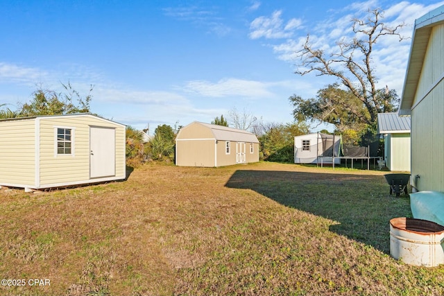 3111 E 2nd Plz, Panama City, FL 32401 - view of grassy yard featuring a trampoline
