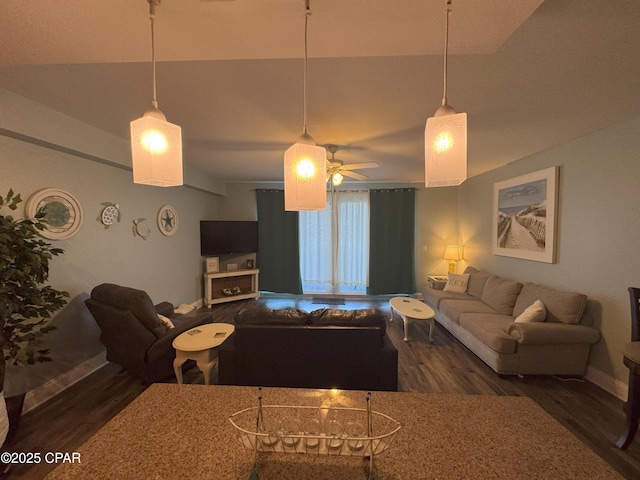 living room featuring ceiling fan, dark wood-type flooring, and lofted ceiling