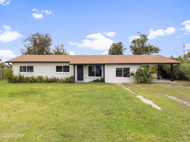 ranch-style house with a carport and a front yard