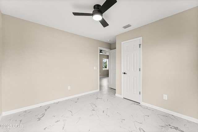 unfurnished room with ceiling fan