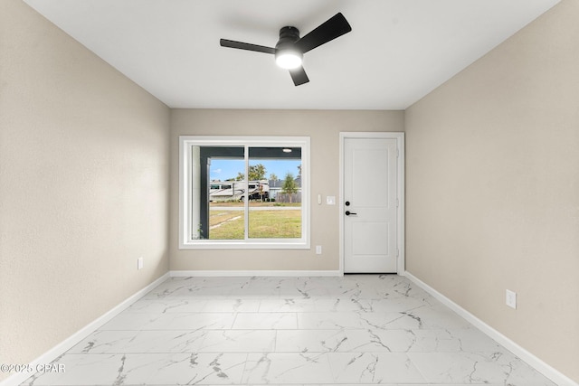 spare room with ceiling fan