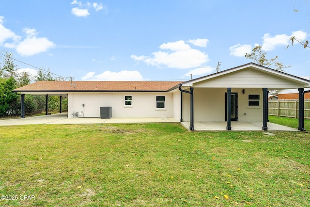 back of house with a lawn, a patio area, and central AC unit