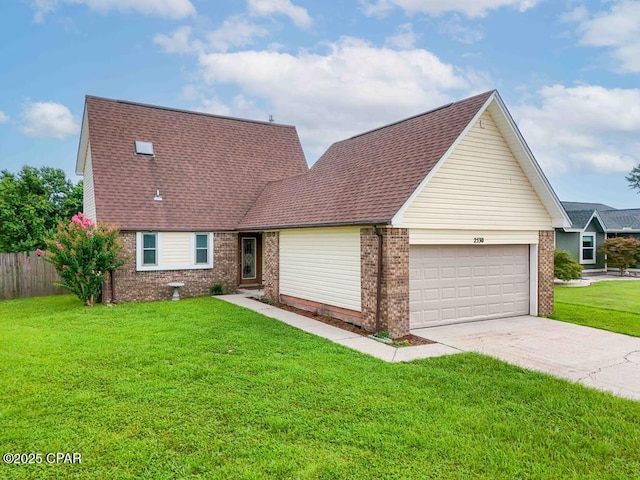 view of front of house featuring a garage and a front lawn