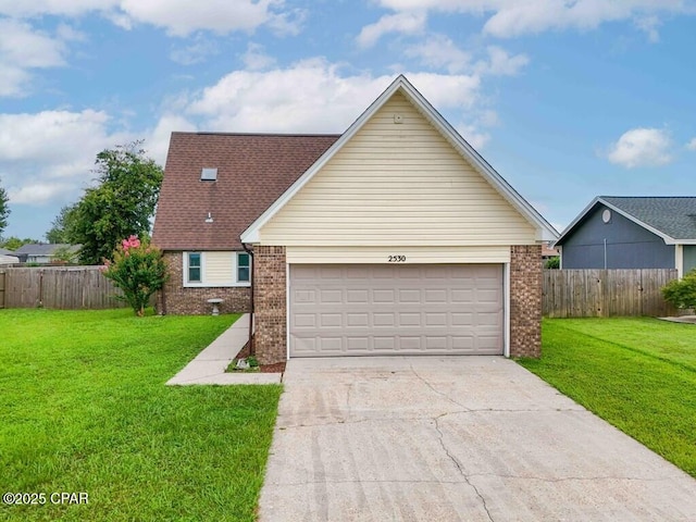 view of front of house with a garage and a front yard