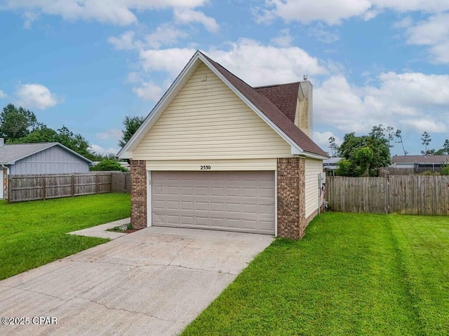 garage with a lawn