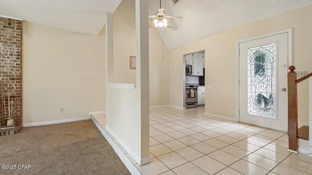 tiled entrance foyer with vaulted ceiling and ceiling fan