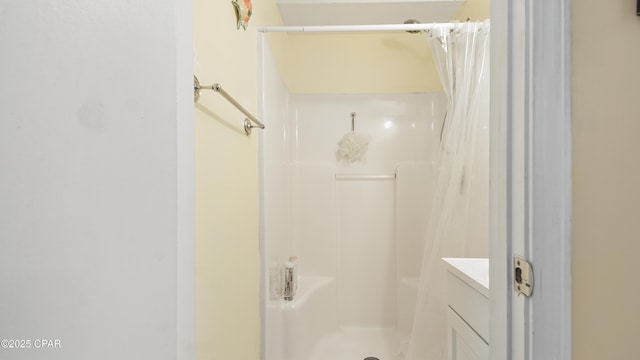 bathroom with vanity and a shower with shower curtain