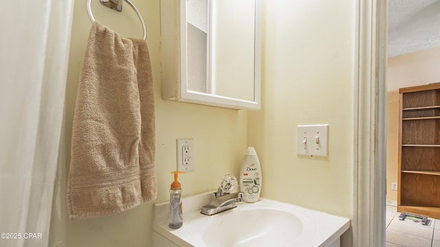 bathroom featuring vanity and tile patterned flooring