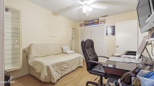 office area with ceiling fan and hardwood / wood-style floors