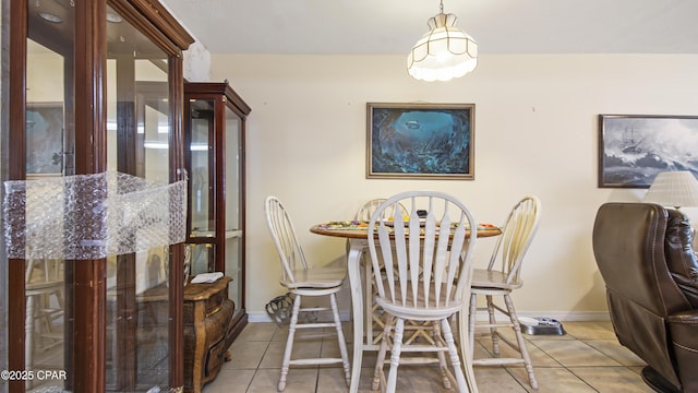 dining area with light tile patterned flooring