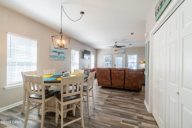 dining area with ceiling fan and dark hardwood / wood-style flooring