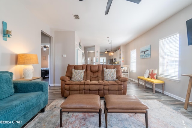 living room with hardwood / wood-style flooring, ceiling fan, and plenty of natural light