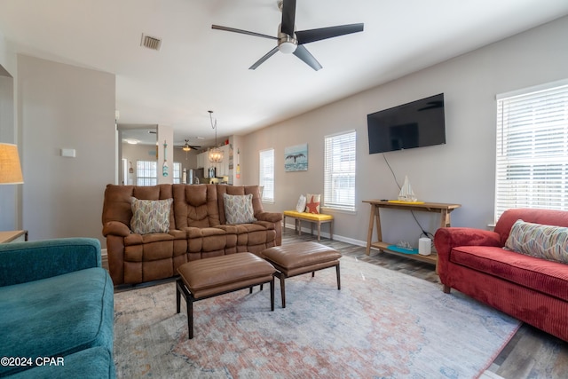 living room featuring hardwood / wood-style floors and ceiling fan