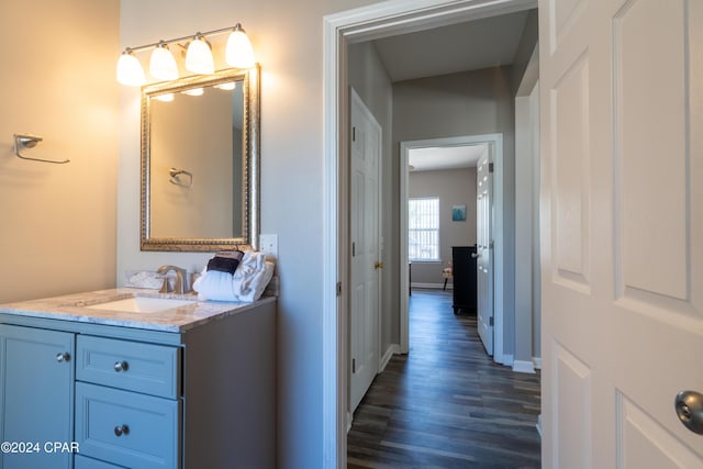 bathroom with vanity and hardwood / wood-style floors