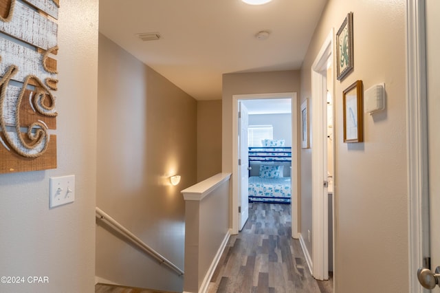 corridor with dark wood-type flooring