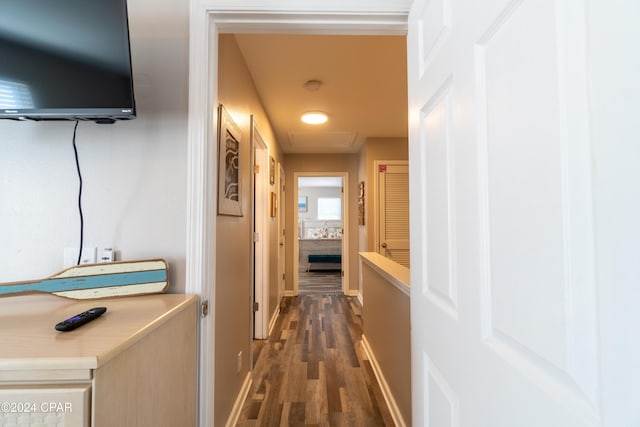 hallway with dark wood-type flooring