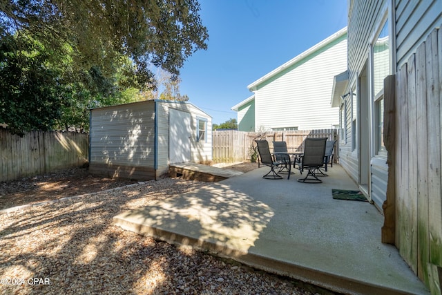 view of patio / terrace featuring a shed