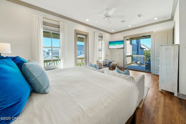 bedroom with dark hardwood / wood-style flooring, ceiling fan, access to exterior, and multiple windows