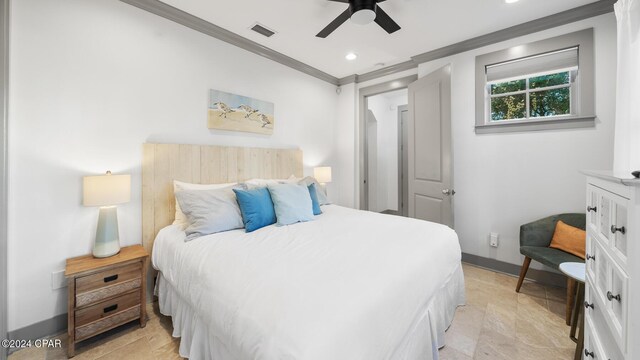 bedroom with ceiling fan and ornamental molding