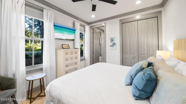 bedroom featuring ceiling fan and ornamental molding