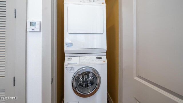 laundry room featuring stacked washer and dryer