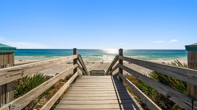 view of home's community featuring a view of the beach and a water view