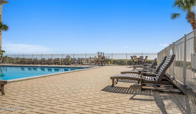 view of swimming pool featuring a patio area