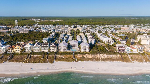 birds eye view of property featuring a view of the beach and a water view