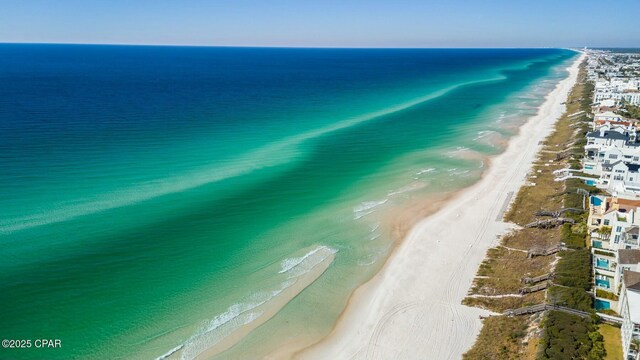 aerial view featuring a water view and a view of the beach