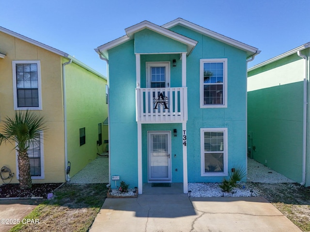 view of front of house featuring a balcony