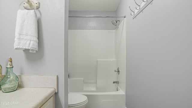 full bathroom featuring vanity, shower / bath combination, a textured ceiling, and toilet