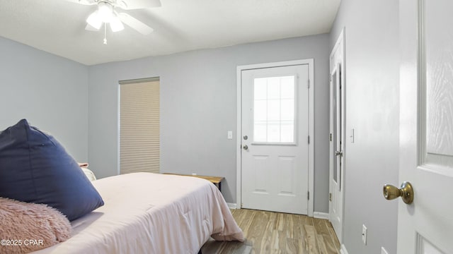 bedroom featuring ceiling fan and light hardwood / wood-style flooring