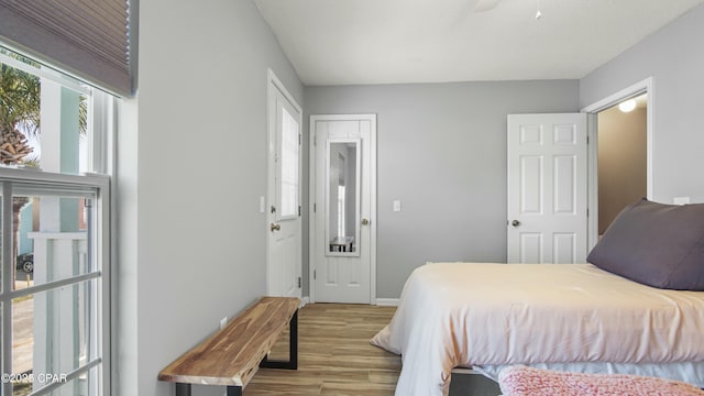 bedroom featuring ceiling fan and light hardwood / wood-style flooring