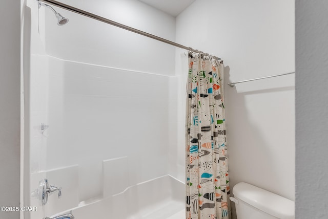 bathroom with shower / bathtub combination with curtain and toilet