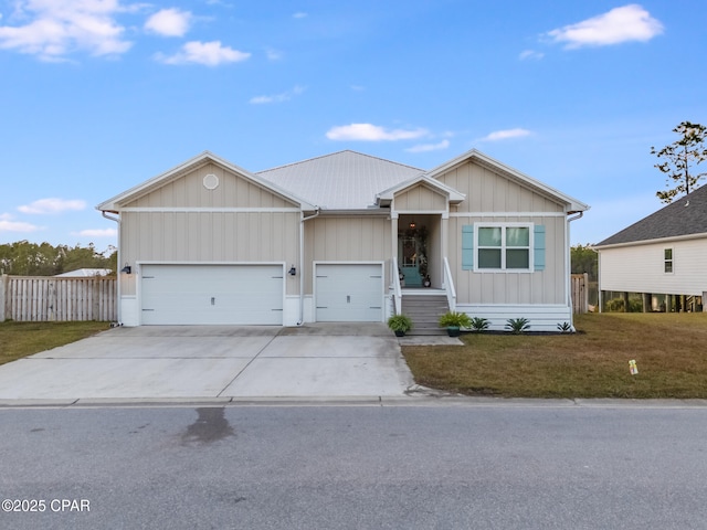 view of front of property with a garage and a front lawn