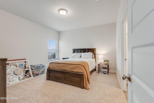 bedroom featuring light colored carpet