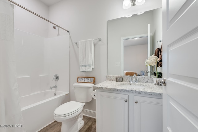 full bathroom featuring wood-type flooring, toilet, tub / shower combination, and vanity