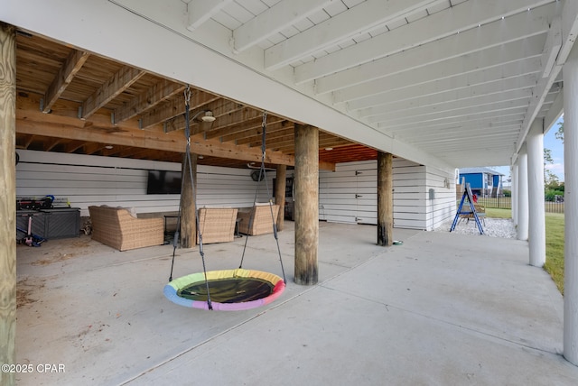 view of patio featuring a playground and an outdoor hangout area